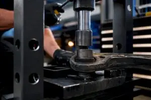 Control arm bushing in hydraulic shop press