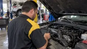 Technician checking live engine misfire data