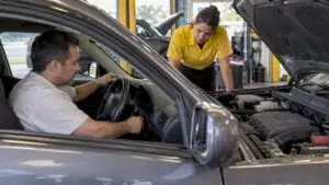 Technician listens as driver attempts to start car