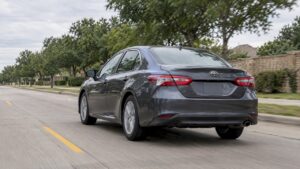 Sedan cruising on an Irving-area road