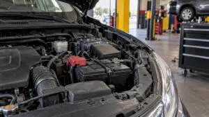 Car battery installed in a Texas service bay